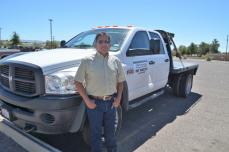 Acosta stands proudly by his truck