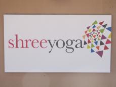 Shree Yoga sign on building exterior