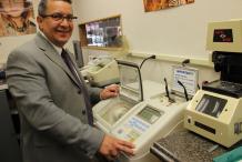 Ray Montoya standing next to equipment and smiling