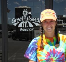 Smiling woman outside her bakery