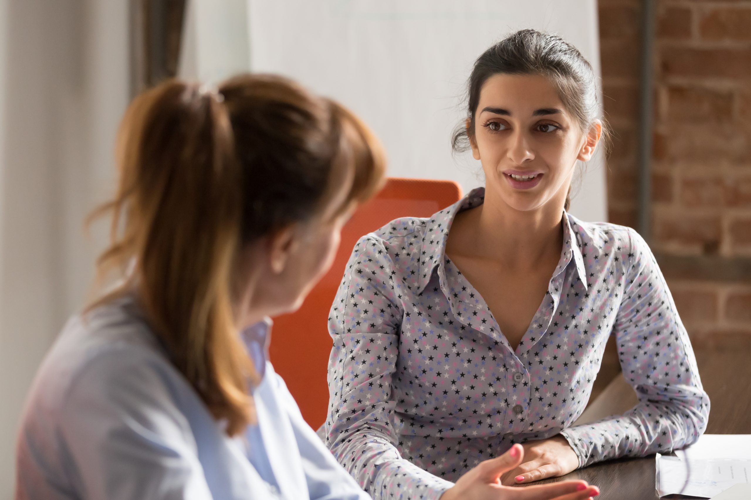 Woman giving counseling to another woman